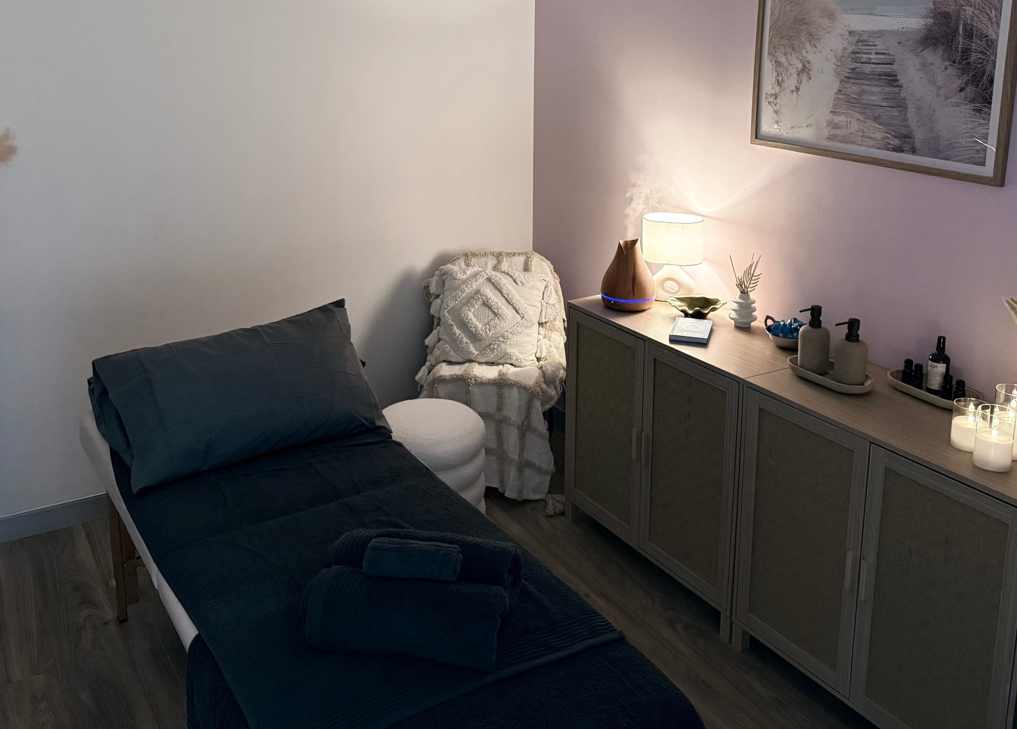 Relaxing massage room at ChasingBetter247 Massage, Malaga, Western Australia, AU with soothing decor and candles.