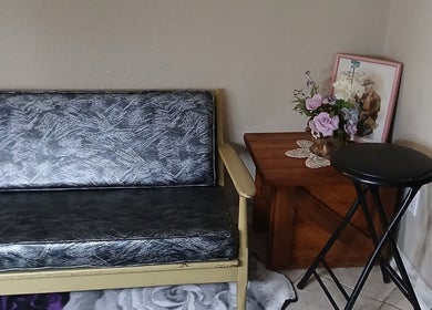 Cozy seating area at Ashley Menoksy nails, Brandon, Florida with rustic decor and floral accents.