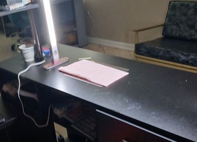 Nail salon desk setup at Ashley Menoksy nails, Brandon, Florida, US, featuring sleek design and bright lighting.