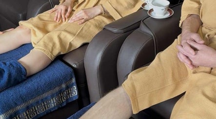 Guests in robes enjoy a foot spa at Silk Spa Balaclava - Head Spa & Body Health & Natural Beauty, Melbourne, Victoria, AU.