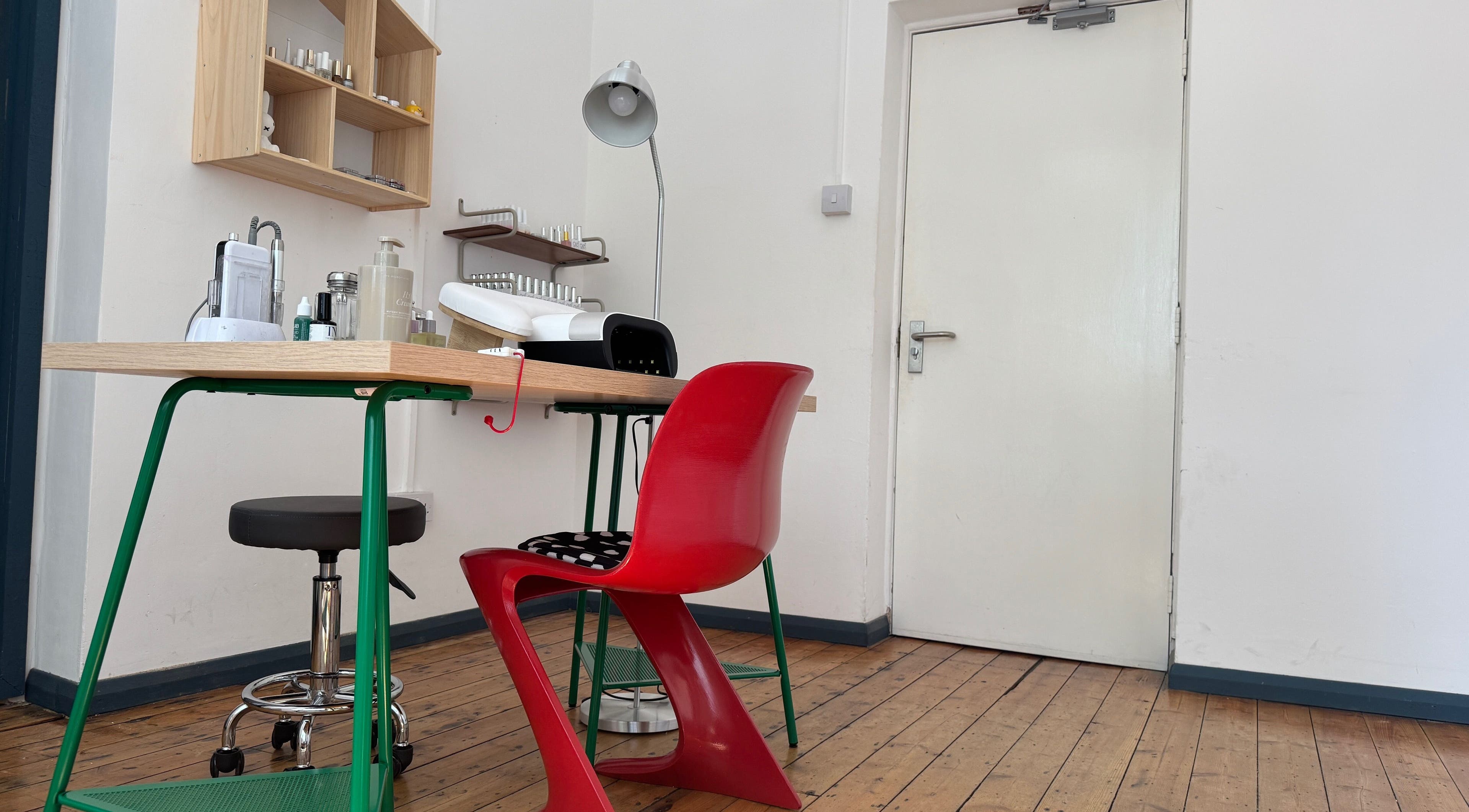 Modern nail station setup at Bling Bling Club in London, England, GB. Features bright decor and stylish furnishings.