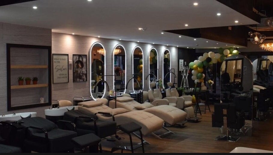 Elegant interior of Hair by Chelsey - Studio 89, Bournemouth, England, GB with chic salon stations.