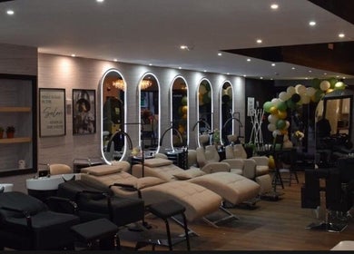 Elegant interior of Hair by Chelsey - Studio 89, Bournemouth, England, GB with chic salon stations.
