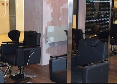 Modern salon interior with chic chairs at Hair by Chelsey - Studio 89, Bournemouth, England, GB.