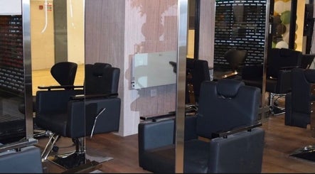 Modern salon interior with chic chairs at Hair by Chelsey - Studio 89, Bournemouth, England, GB.