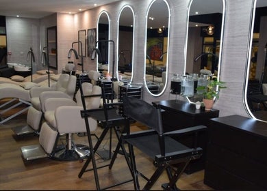 Chic salon interior at Hair by Chelsey - Studio 89 in Bournemouth, England, GB, featuring sleek mirrors and chairs.