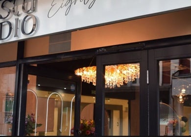 Elegant storefront of Hair by Chelsey - Studio 89, Bournemouth, England, GB with crystal chandelier.