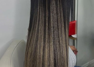Elegant ombre hair styling at Jaylicious Beauty, Ballito, Kwazulu-natal, ZA showcasing long, sleek strands.