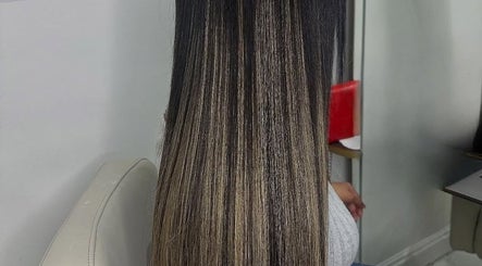 Elegant ombre hair styling at Jaylicious Beauty, Ballito, Kwazulu-natal, ZA showcasing long, sleek strands.