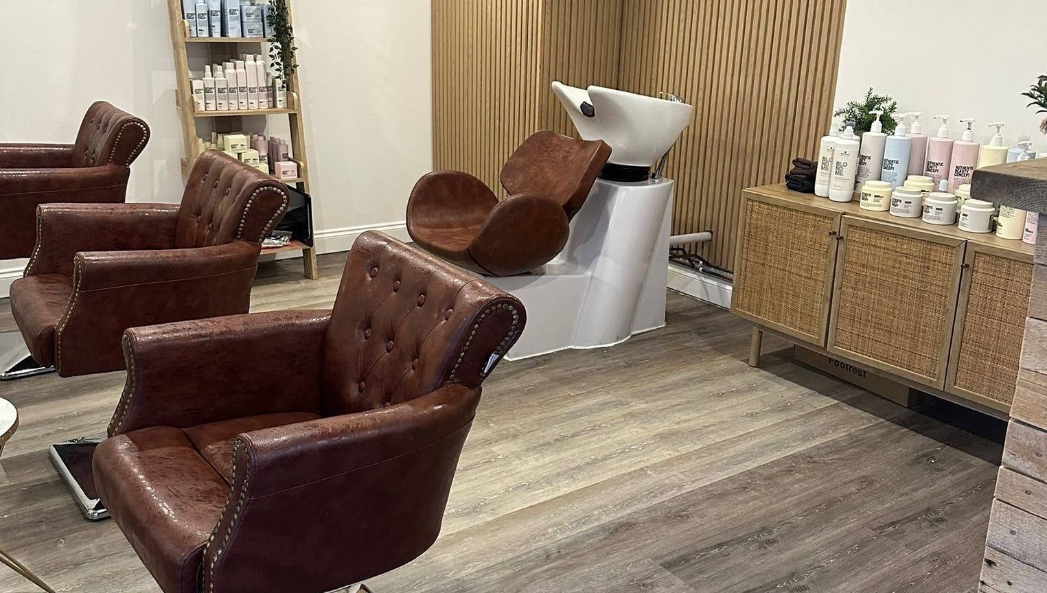 Elegant salon chairs and wash station at C.B Colour in Portishead, England, GB.