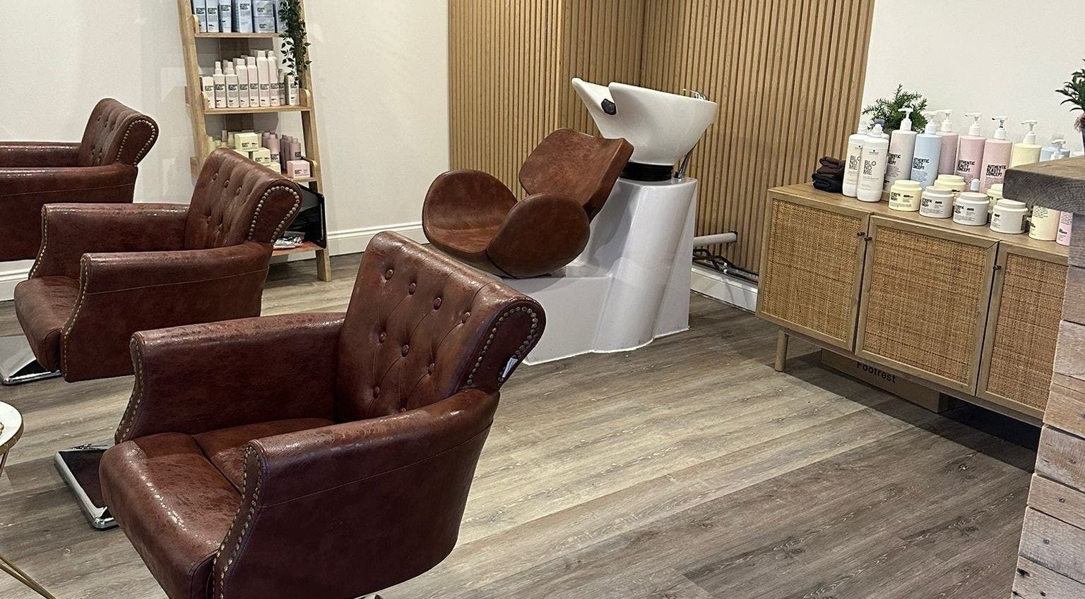 Elegant salon chairs and wash station at C.B Colour in Portishead, England, GB.