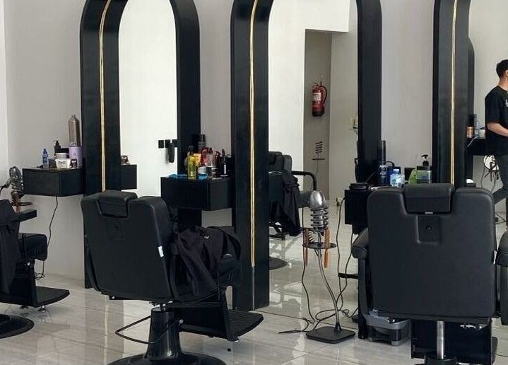 Modern interior of Alfa Barber - حلاق ألفا in Buraydah, Al Qassim Province, SA, showcasing stylish barber chairs.