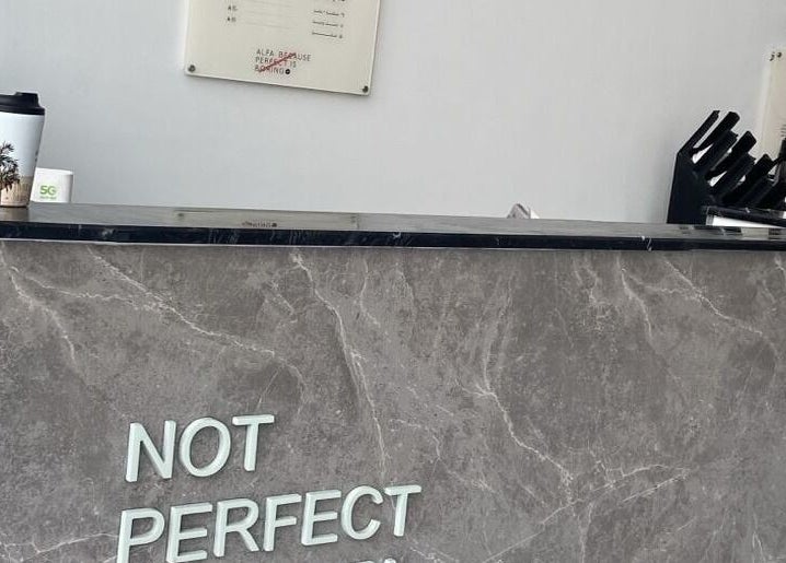 Reception desk at Alfa Barber - حلاق ألفا, Buraydah, Al Qassim Province, SA with a modern marble finish.