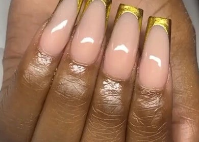 Elegant gold-accented nails at Layanails, Nassau, New Providence, BS, showcasing glossy manicure.