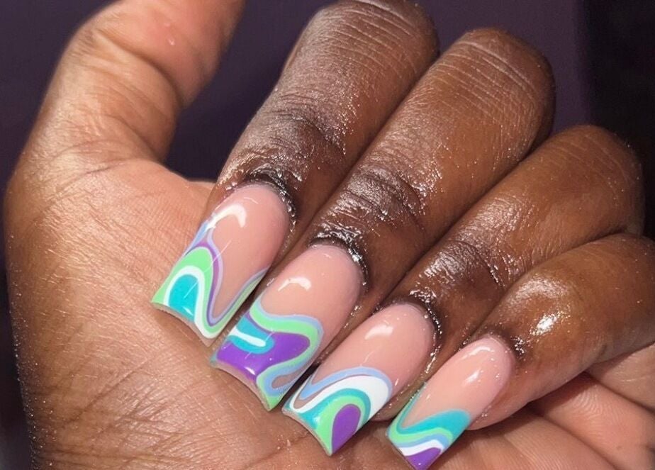 Vibrant swirling nail art at Layanails, Nassau, New Providence, BS. Perfect for unique style seekers.