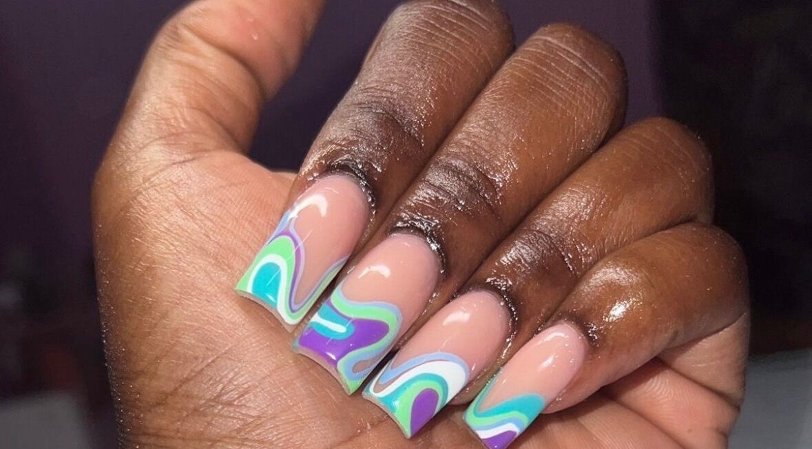 Vibrant swirling nail art at Layanails, Nassau, New Providence, BS. Perfect for unique style seekers.