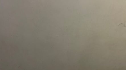 Calming minimalist wall at Sydney Massage in Parramatta, New South Wales, AU, enhancing relaxation ambiance.
