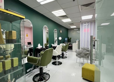 Interior view of Dar Almas Beauty Salon in Dubai, Dubai, AE, showcasing stylish chairs and modern decor.