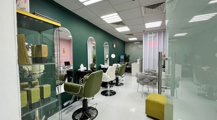Interior view of Dar Almas Beauty Salon in Dubai, Dubai, AE, showcasing stylish chairs and modern decor.
