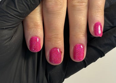 Shiny pink glitter manicure at The Nail Garden, Old Woods, Bomere Heath, England, GB.
