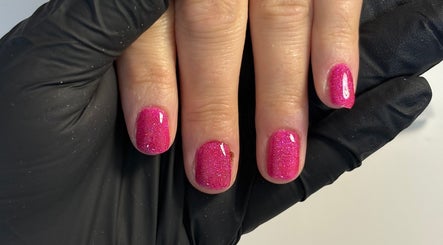Shiny pink glitter manicure at The Nail Garden, Old Woods, Bomere Heath, England, GB.