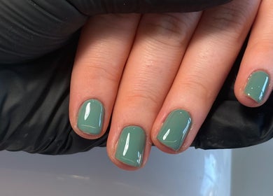Teal manicured nails at The Nail Garden, Old Woods, Bomere Heath, England, GB showcased by a professional.