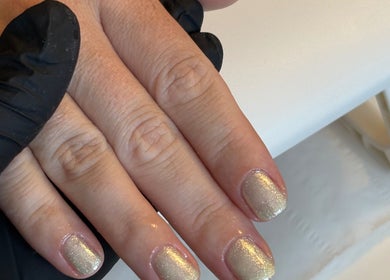 Elegant golden nails adorned at The Nail Garden, Old Woods, Bomere Heath, England, GB.