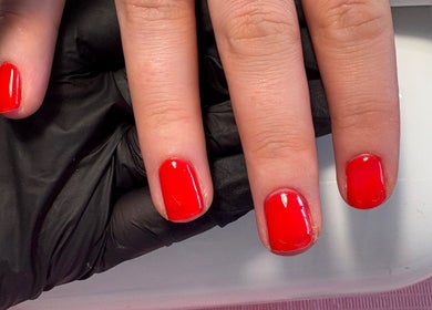 Red manicured nails at The Nail Garden, Old Woods, Bomere Heath, England, GB.