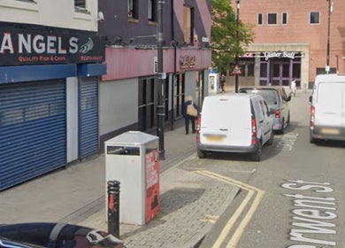 Bysophiew street view in Sunderland, England, GB, featuring local businesses and parked vehicles.