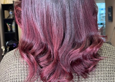 Stylish maroon curls at Ryi Perfect’d It, Dayton, Ohio, US, showcasing vibrant hair coloring.