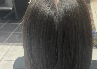 Sleek hairstyle done at Ryi Perfect’d It in Dayton, Ohio, US, showcasing a smooth, professional finish.
