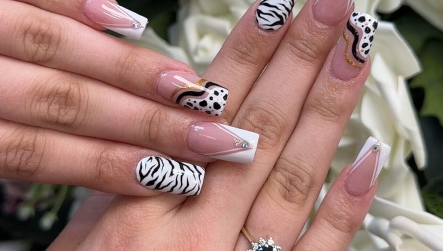 Creative nail designs with zebra patterns at Beauty Style Salon, Merstham, England, GB.