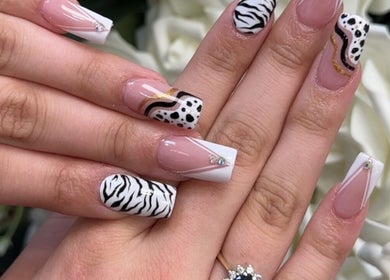 Creative nail designs with zebra patterns at Beauty Style Salon, Merstham, England, GB.