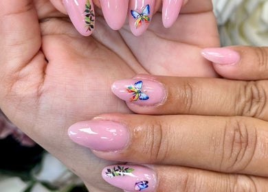 Stunning butterfly nail art at Beauty Style Salon in Merstham, England, GB, showcasing intricate designs.
