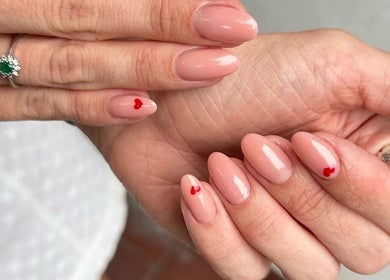 Elegant nude manicure with red heart at Beauty Style Salon, Merstham, England, GB. Perfect for any occasion.