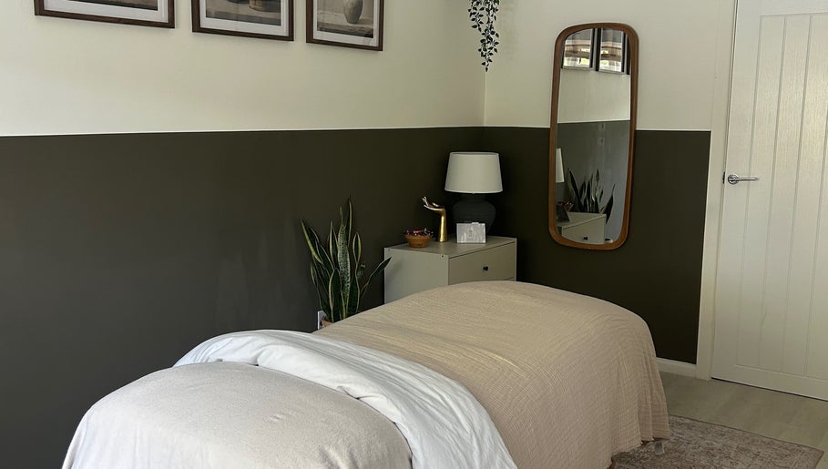 Relaxing therapy room at Skin And Soul, New Milton, England, GB, featuring cozy bedding and soothing decor.