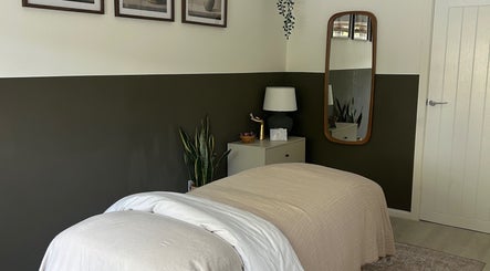 Relaxing therapy room at Skin And Soul, New Milton, England, GB, featuring cozy bedding and soothing decor.