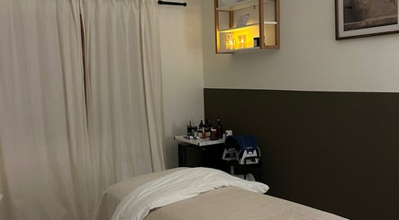 Relaxing treatment room at Skin And Soul, New Milton, England, GB, with a massage bed and soft lighting.