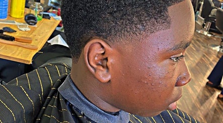Close-up of a stylish haircut at Magic_cut, New York, New York, US, showcasing a precise fade style.
