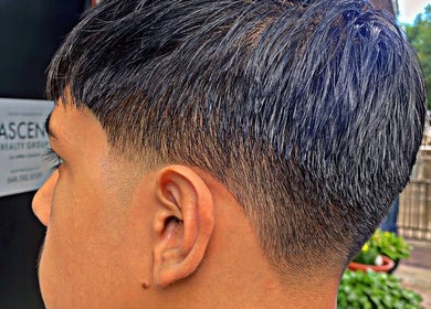 Close-up of a stylish haircut at Magic_cut, New York, New York, US, highlighting expert styling details.