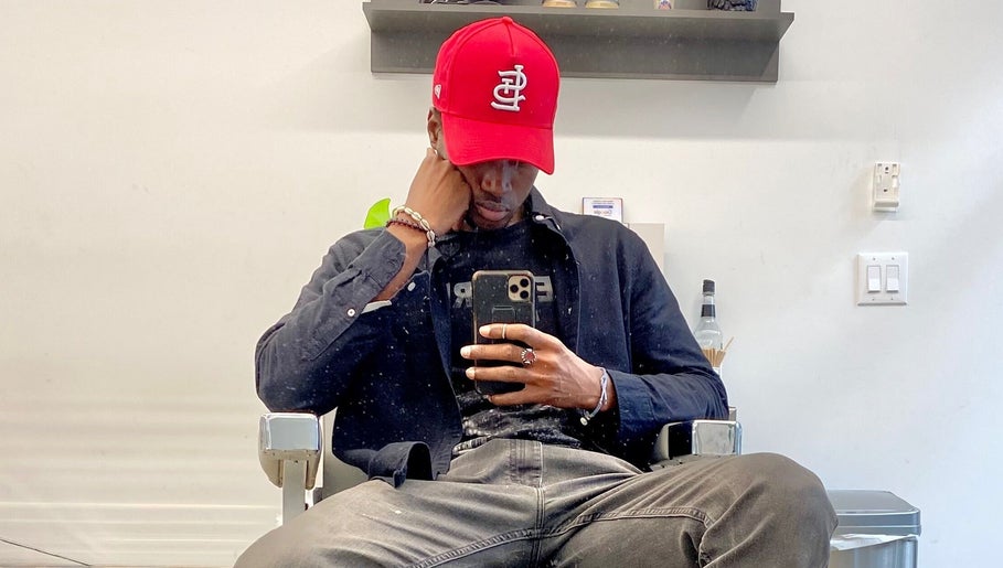 Client sitting in Magic_hand_cut salon, New York, New York, US, capturing a stylish moment.