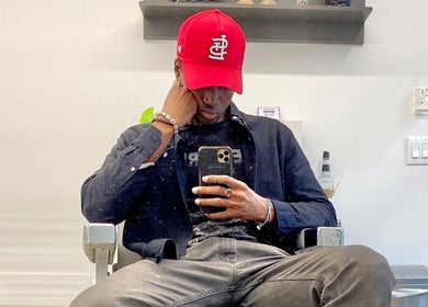 Client sitting in Magic_hand_cut salon, New York, New York, US, capturing a stylish moment.