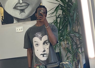 Artistic interior at Magic_hand_cut, New York, New York, US with vivid artwork and greenery.