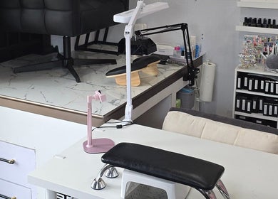 Modern nail station setup at Artsy Digits Nails, Hamilton, Ontario, CA, showcasing a comfortable work area.
