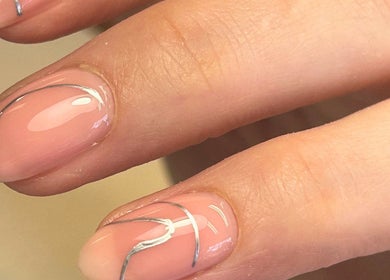 Close-up of elegant pink nails with silver lines at Poppy’s beauty room, Pulborough, England, GB.