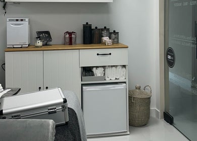 Interior of Saona Beauty Clinic in Pembroke Pines, Florida, US featuring a cozy treatment room setup.