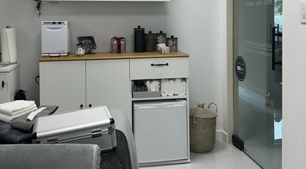 Interior of Saona Beauty Clinic in Pembroke Pines, Florida, US featuring a cozy treatment room setup.