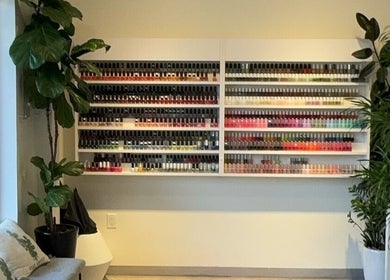 Colorful nail polish display at NUMI NAILS & SPA, Hillsdale, New Jersey, US, showcasing vast selection.