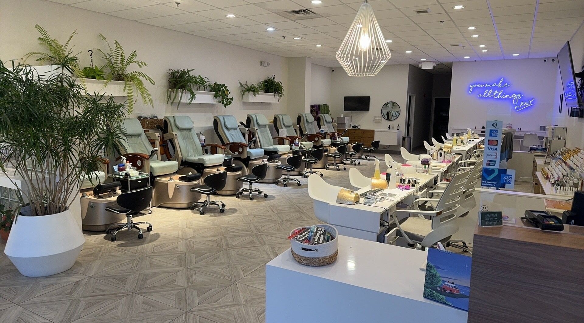 Elegant interior of Numi Nails & Spa in Hillsdale, New Jersey, US, featuring stylish chairs and modern decor.