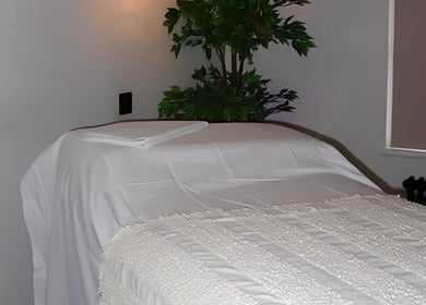 Tranquil spa room at Figured It in Hessle, England, GB with a massage table and calming decor.